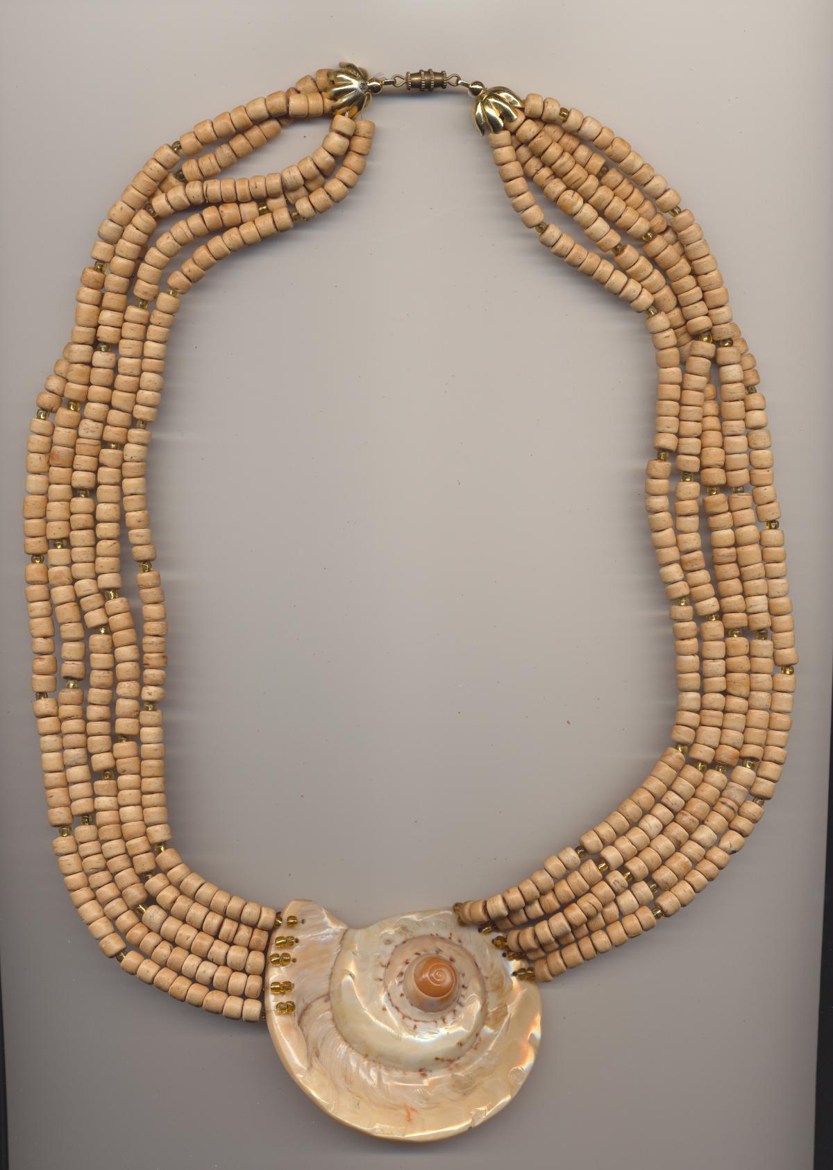 Necklace made of sliced Conus shell, coconut and small glass beads, Philippines, inner length 24'' 60cm., outer length 26'' 66cm.