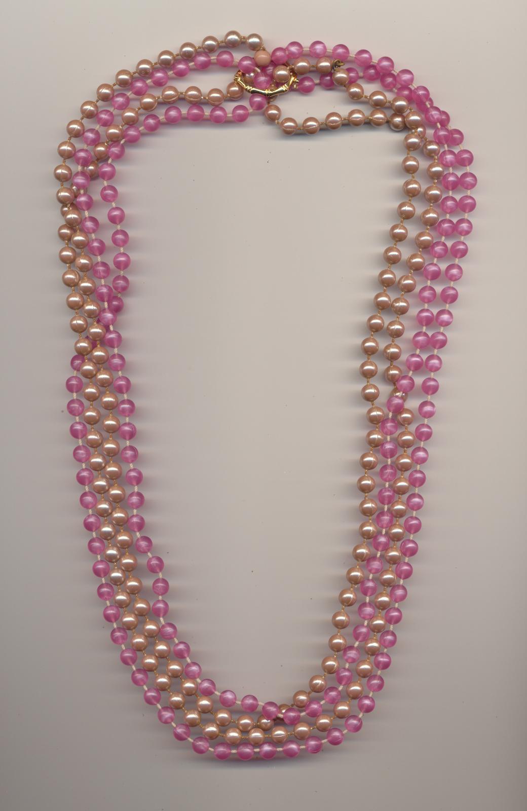 A four strand bead necklace made of two necklaces and a pearl shortener