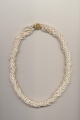 A twisted necklace made of 10 strands freshwater pearls of the same length